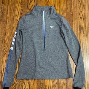 Athletic long sleeve quarter zip with thumb holes.